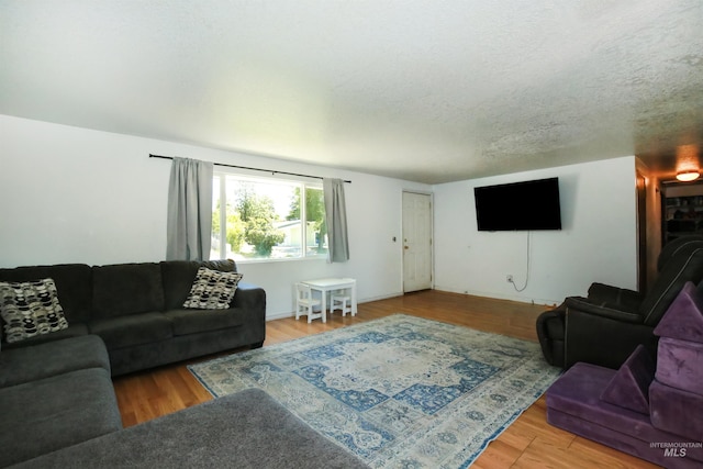 1765 W 6th St, Weiser, ID 83672 - living room featuring wood finished floors and a textured ceiling