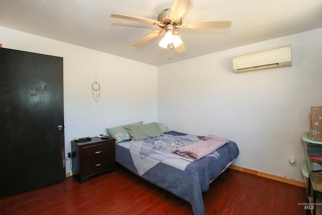 1765 W 6th St, Weiser, ID 83672 - bedroom with an AC wall unit, wood finished floors, baseboards, and a ceiling fan