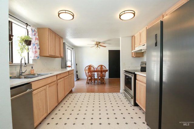 1765 W 6th St, Weiser, ID 83672 - kitchen with appliances with stainless steel finishes, light brown cabinetry, a sink, light flooring, and healthy amount of natural light