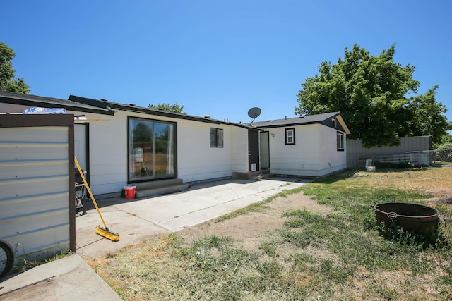 1765 W 6th St, Weiser, ID 83672 - rear view of property with entry steps and a patio area