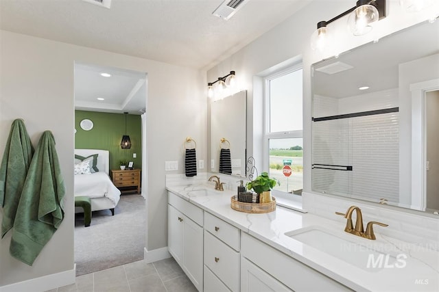 5591 W Aralia Dr, Meridian, ID 83646 - full bath featuring tile patterned floors, double vanity, a sink, and connected bathroom