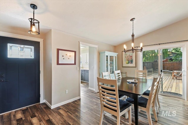 3118 Fircrest Ave, Caldwell, ID 83605 - dining room with a chandelier, dark wood-type flooring, and vaulted ceiling