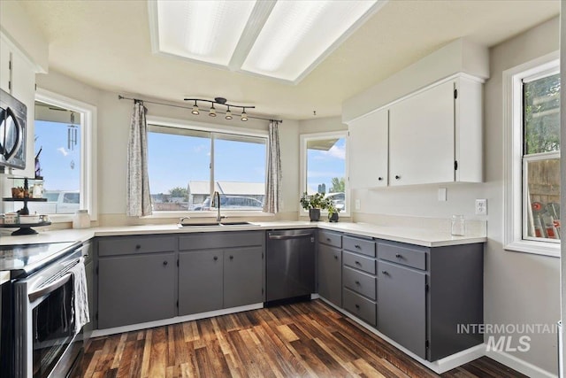 3118 Fircrest Ave, Caldwell, ID 83605 - kitchen featuring stainless steel appliances, gray cabinets, dark wood finished floors, and white cabinets