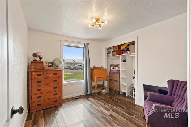 3118 Fircrest Ave, Caldwell, ID 83605 - sitting room with dark wood-style flooring and a textured ceiling