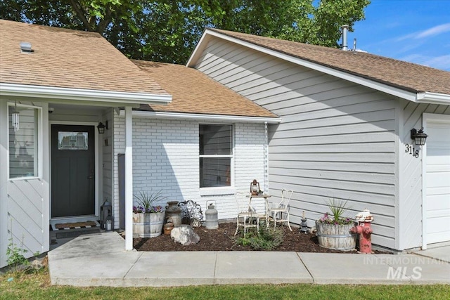 3118 Fircrest Ave, Caldwell, ID 83605 - entrance to property featuring roof with shingles and brick siding