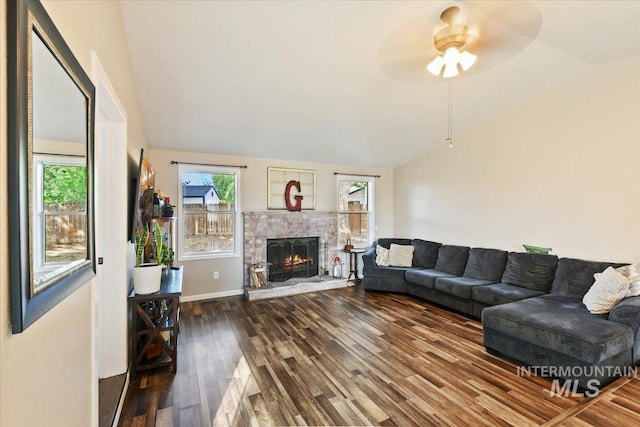 3118 Fircrest Ave, Caldwell, ID 83605 - living area featuring lofted ceiling, wood finished floors, ceiling fan, and a stone fireplace