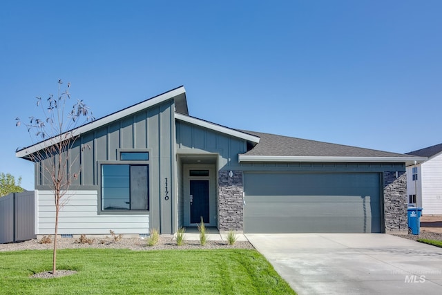 view of front of home featuring a garage, concrete driveway, crawl space, a front lawn, and board and batten siding