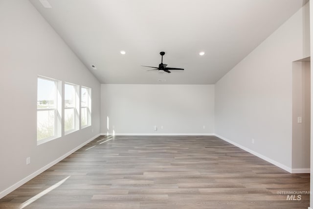 unfurnished room featuring light wood finished floors, baseboards, and recessed lighting