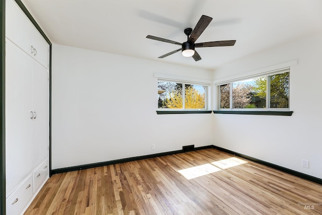 1706 Hervey, Boise, ID 83705 - empty room featuring baseboards, light wood-style floors, a healthy amount of sunlight, and a ceiling fan