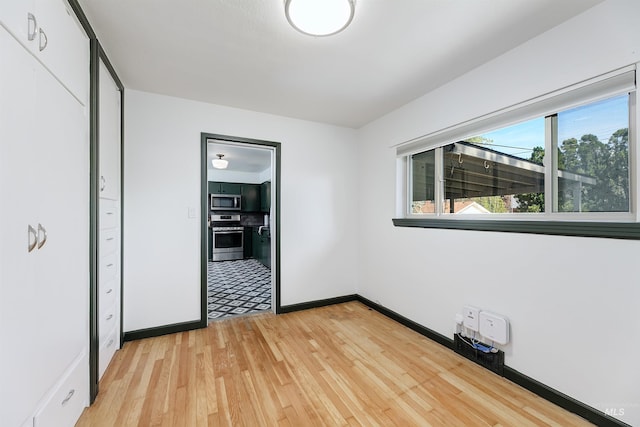1706 Hervey, Boise, ID 83705 - unfurnished bedroom featuring baseboards and light wood-type flooring