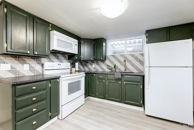 1706 Hervey, Boise, ID 83705 - kitchen featuring tasteful backsplash, white appliances, dark countertops, and green cabinets