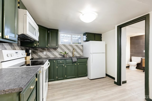 1706 Hervey, Boise, ID 83705 - kitchen with white appliances, dark countertops, and green cabinetry