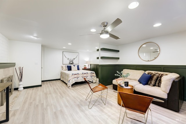 1706 Hervey, Boise, ID 83705 - bedroom with light wood-type flooring, a tiled fireplace, ceiling fan, and recessed lighting
