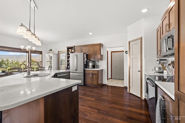 2510 Westridge Ct, Clarkston, WA 99403 - kitchen with light countertops, dark wood finished floors, stainless steel appliances, and a sink