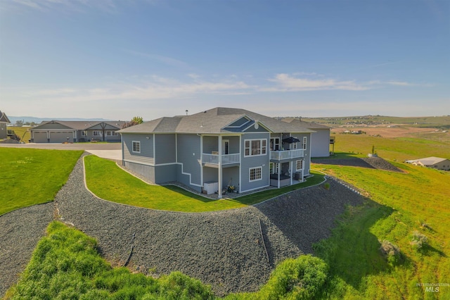 2510 Westridge Ct, Clarkston, WA 99403 - back of property with a yard, gravel driveway, and a balcony
