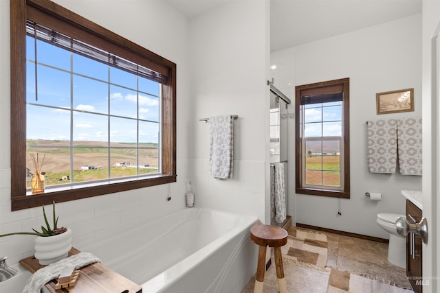 2510 Westridge Ct, Clarkston, WA 99403 - full bath featuring a shower stall, baseboards, a garden tub, and toilet