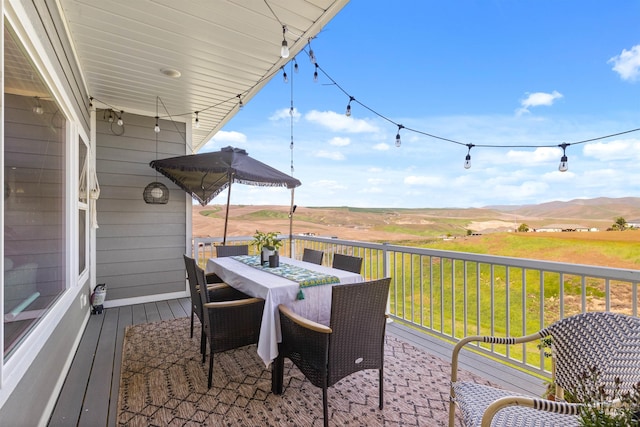 2510 Westridge Ct, Clarkston, WA 99403 - deck featuring outdoor dining space, a mountain view, and a lawn