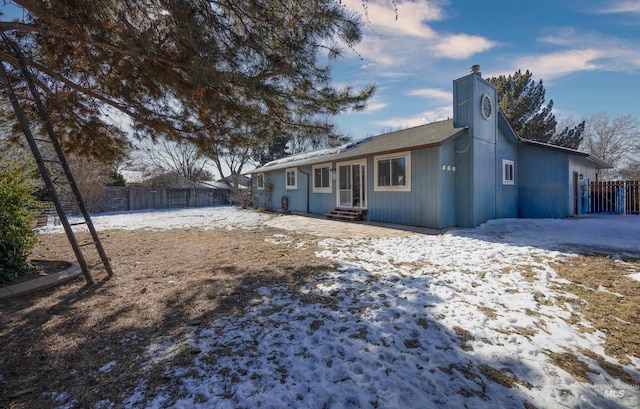 exterior space with entry steps and fence