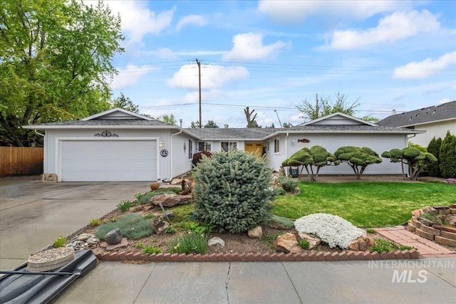 ranch-style house with an attached garage, fence, a front yard, and concrete driveway