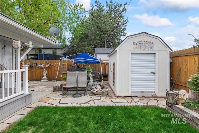 view of shed with a fenced backyard