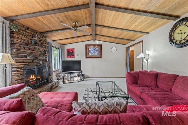 living room with lofted ceiling with beams, wooden ceiling, carpet, and a fireplace