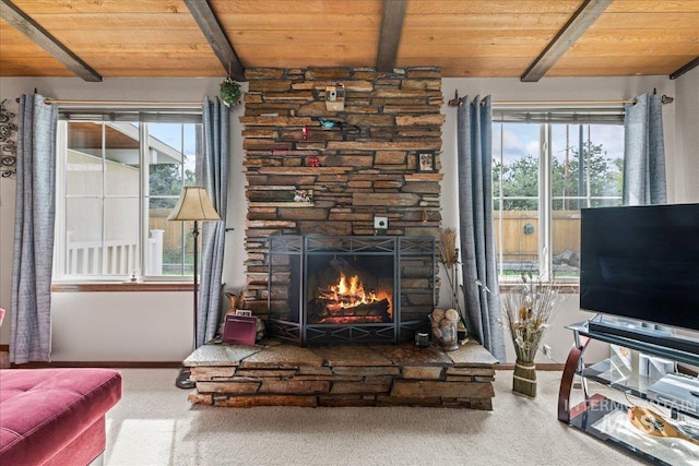 living room featuring a fireplace, wood ceiling, beamed ceiling, and carpet floors