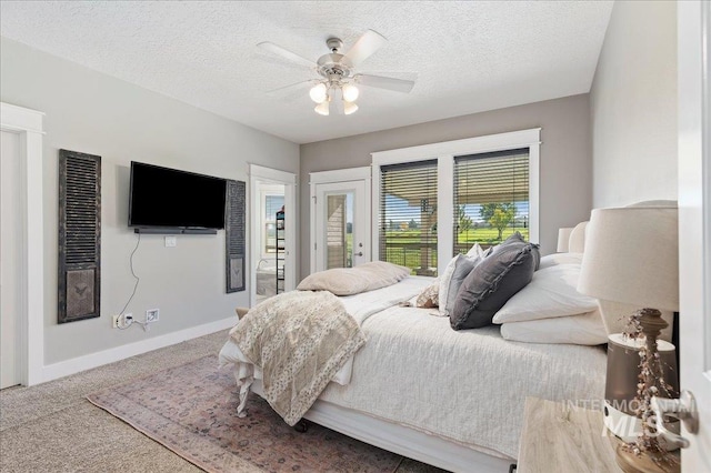 bedroom with carpet, a textured ceiling, access to exterior, and ceiling fan