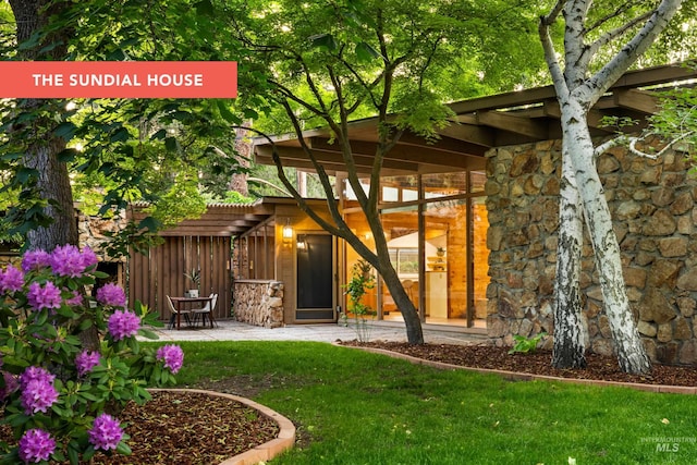 2036 N Blaine Way, Boise, ID 83702 - doorway to property with a lawn and a patio