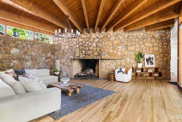 2036 N Blaine Way, Boise, ID 83702 - living room featuring wood ceiling with exposed beams, hardwood / wood-style floors, a fireplace, and a chandelier