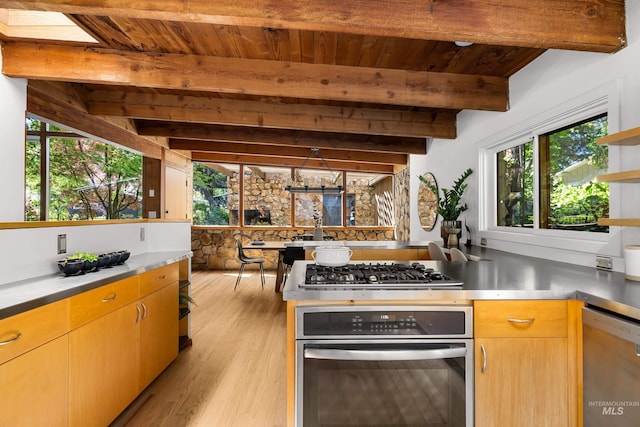2036 N Blaine Way, Boise, ID 83702 - kitchen featuring stainless steel appliances, stainless steel countertops, open shelves, healthy amount of natural light, and wooden ceiling with exposed beams