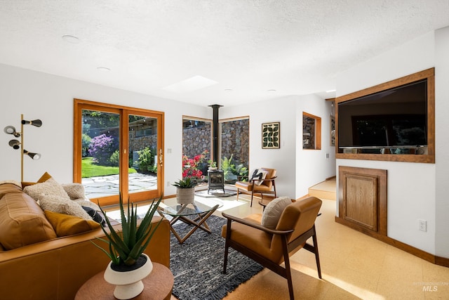2036 N Blaine Way, Boise, ID 83702 - living area with light flooring, baseboards, and a skylight