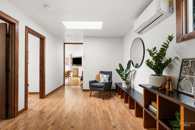 2036 N Blaine Way, Boise, ID 83702 - sitting room with a skylight, a wall mounted AC, light wood-type flooring, and baseboards