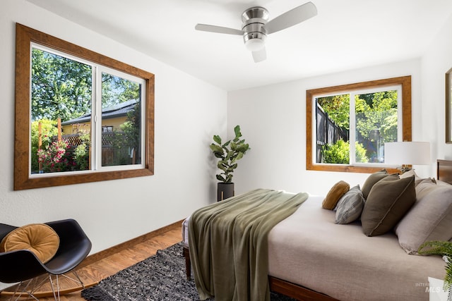 2036 N Blaine Way, Boise, ID 83702 - bedroom with wood finished floors, baseboards, and ceiling fan