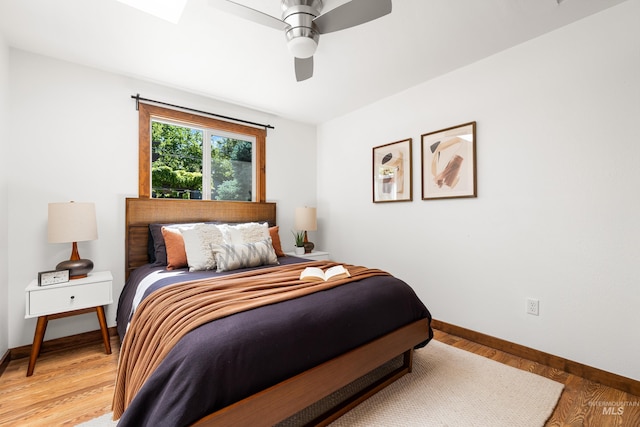 2036 N Blaine Way, Boise, ID 83702 - bedroom with baseboards, light wood-style floors, and a ceiling fan