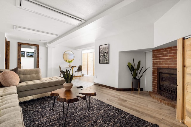 2036 N Blaine Way, Boise, ID 83702 - living area featuring light wood finished floors, a fireplace, and baseboards