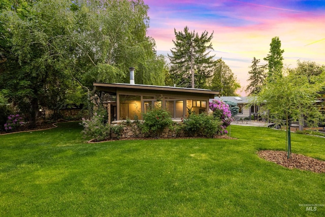 2036 N Blaine Way, Boise, ID 83702 - back of house at dusk with a yard