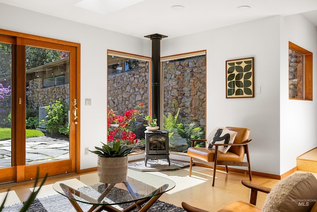 2036 N Blaine Way, Boise, ID 83702 - sitting room featuring a wood stove and baseboards