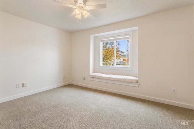 spare room with ceiling fan and carpet floors