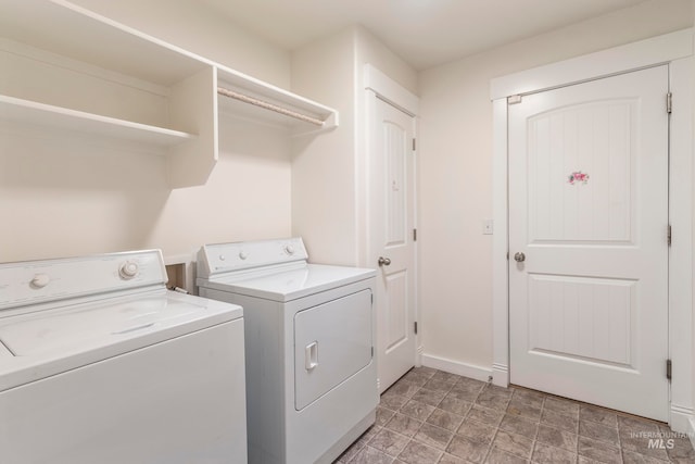 clothes washing area with washer and dryer