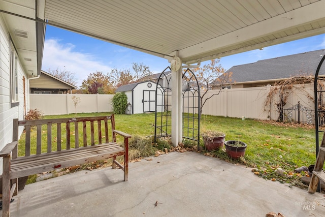 view of patio with a storage unit