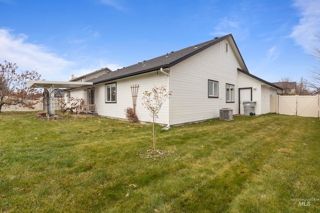 rear view of house with a lawn