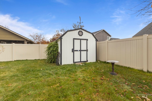 view of outbuilding featuring a lawn