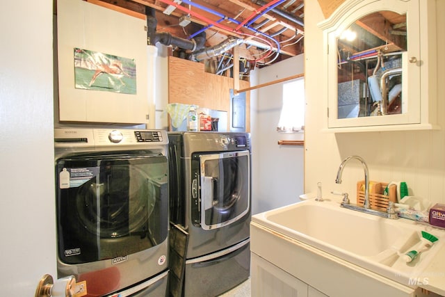laundry area featuring washer and clothes dryer and sink
