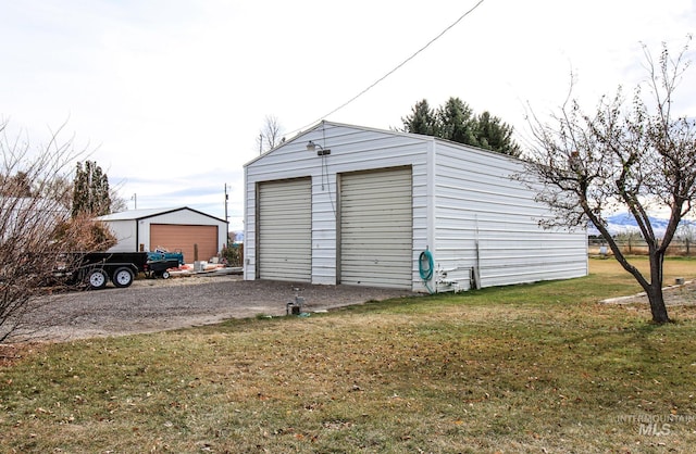 garage featuring a yard