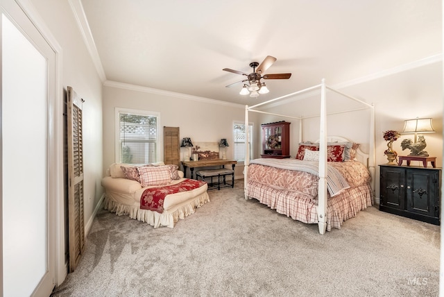 carpeted bedroom featuring ceiling fan and ornamental molding