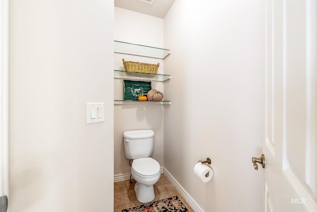 bathroom with tile patterned floors and toilet