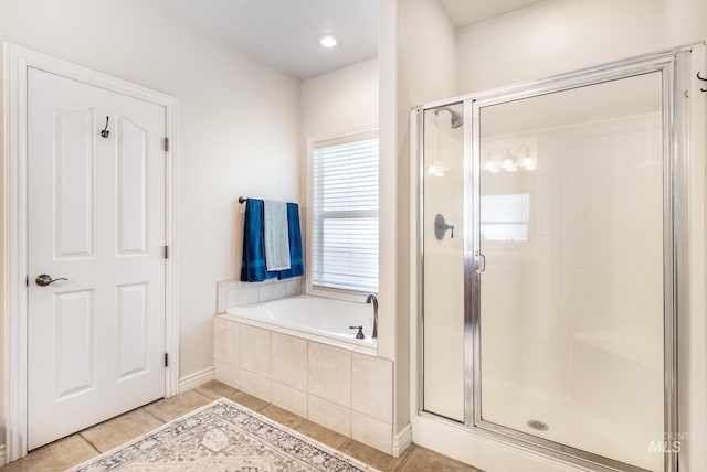 bathroom featuring tile patterned floors and plus walk in shower