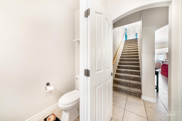 bathroom featuring tile patterned flooring and toilet