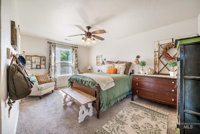 bedroom featuring ceiling fan and light carpet