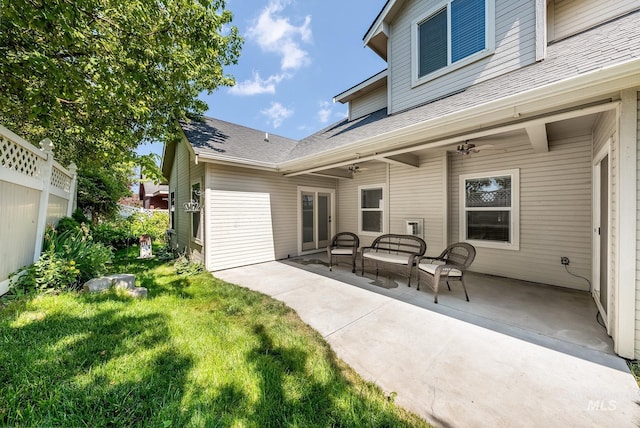 rear view of house featuring a patio area, ceiling fan, and a yard